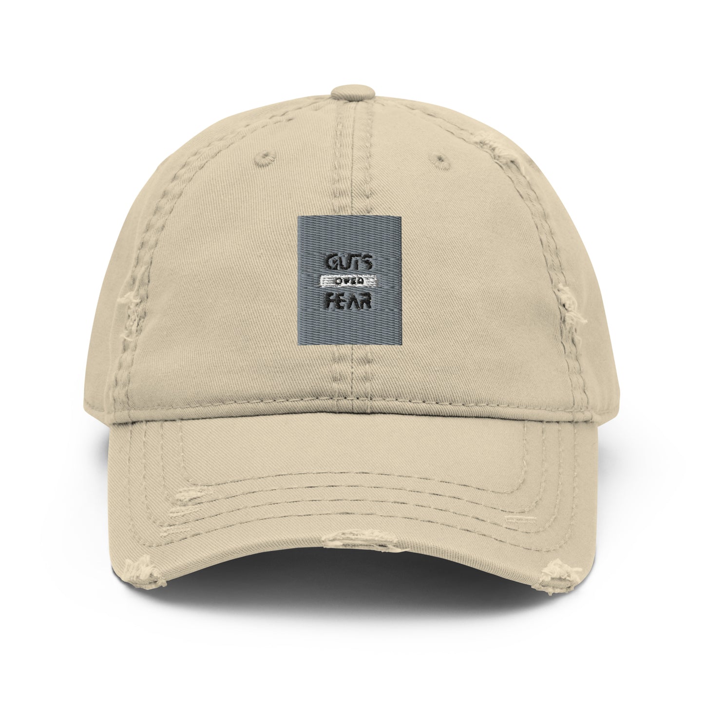 Image of a stone coloured dad hat with the logo 'Guts Over Fear' embroidered in black thread on the front. The hat has a curved brim and an adjustable strap at the back for a comfortable fit."